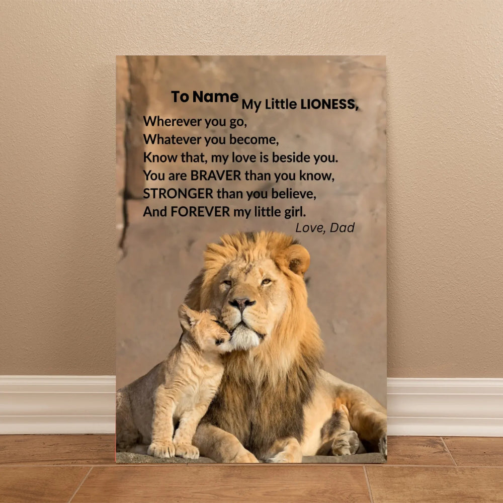 Canvas print with a lion and cub and a motivational quote on a beige wall.