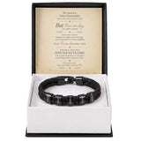 A black beaded bracelet with silver letter beads spelling 'LOVE' across multiple links, presented in a white box with a black outer base. The box is open to show a sentimental message card inside.