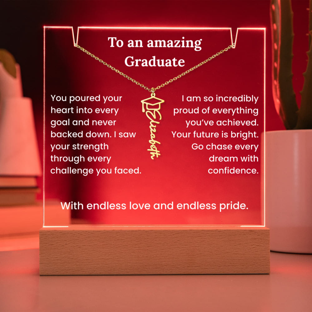 Decorative plaque with a necklace and graduation cap pendant, featuring text to an amazing graduate.