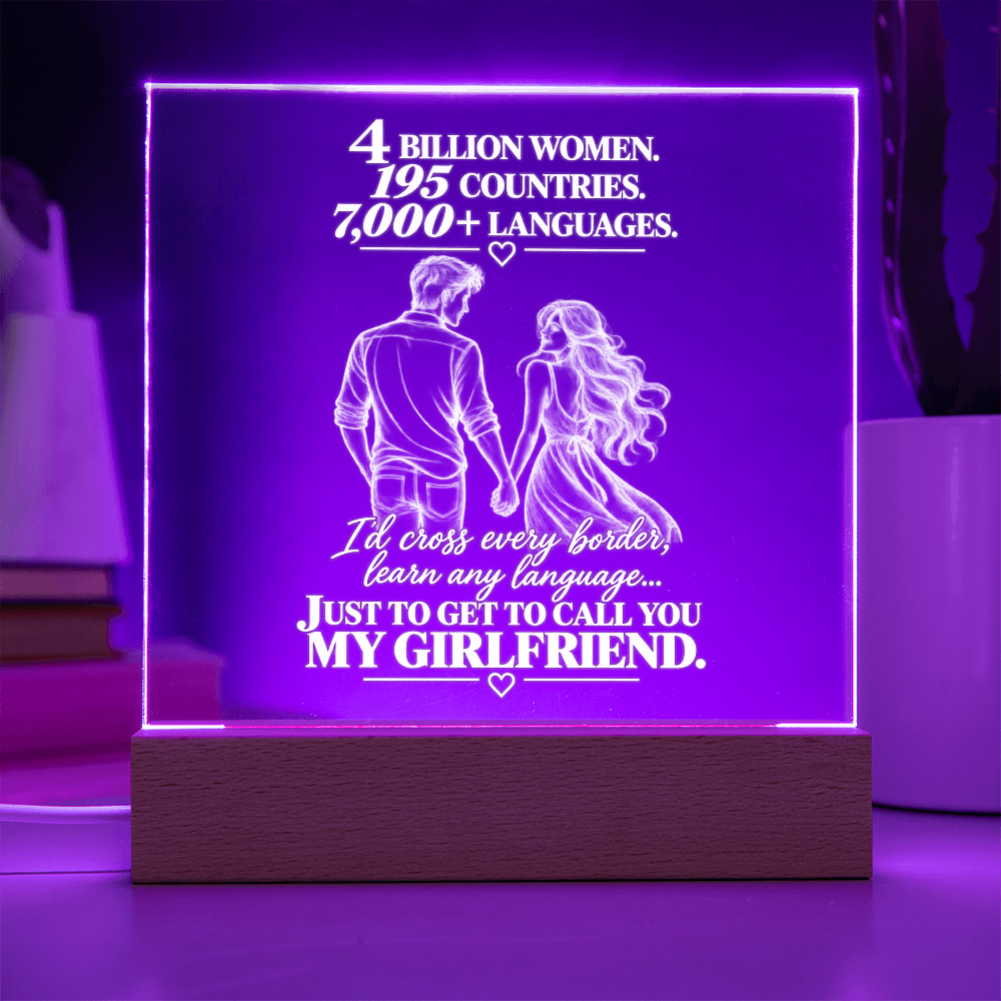 A rectangular acrylic LED lamp glowing with purple light on a wooden base, featuring white engraved text and an illustration of a couple with hearts. The message reads, 'I CHOSE YOU without knowing where life would take us.
