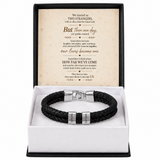 A black braided leather bracelet with silver-toned metal accents, presented in a white gift box with a black outer frame. The inside lid features a printed sentimental message card.