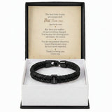 A black braided leather bracelet with a black metal clasp engraved with 'MORGAN', presented in an open white gift box with a black outer base. The inside lid features a printed sentimental poem on beige paper.
