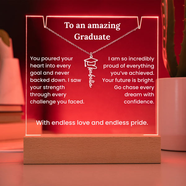 Decorative plaque with a necklace design and graduation message on a wooden base.