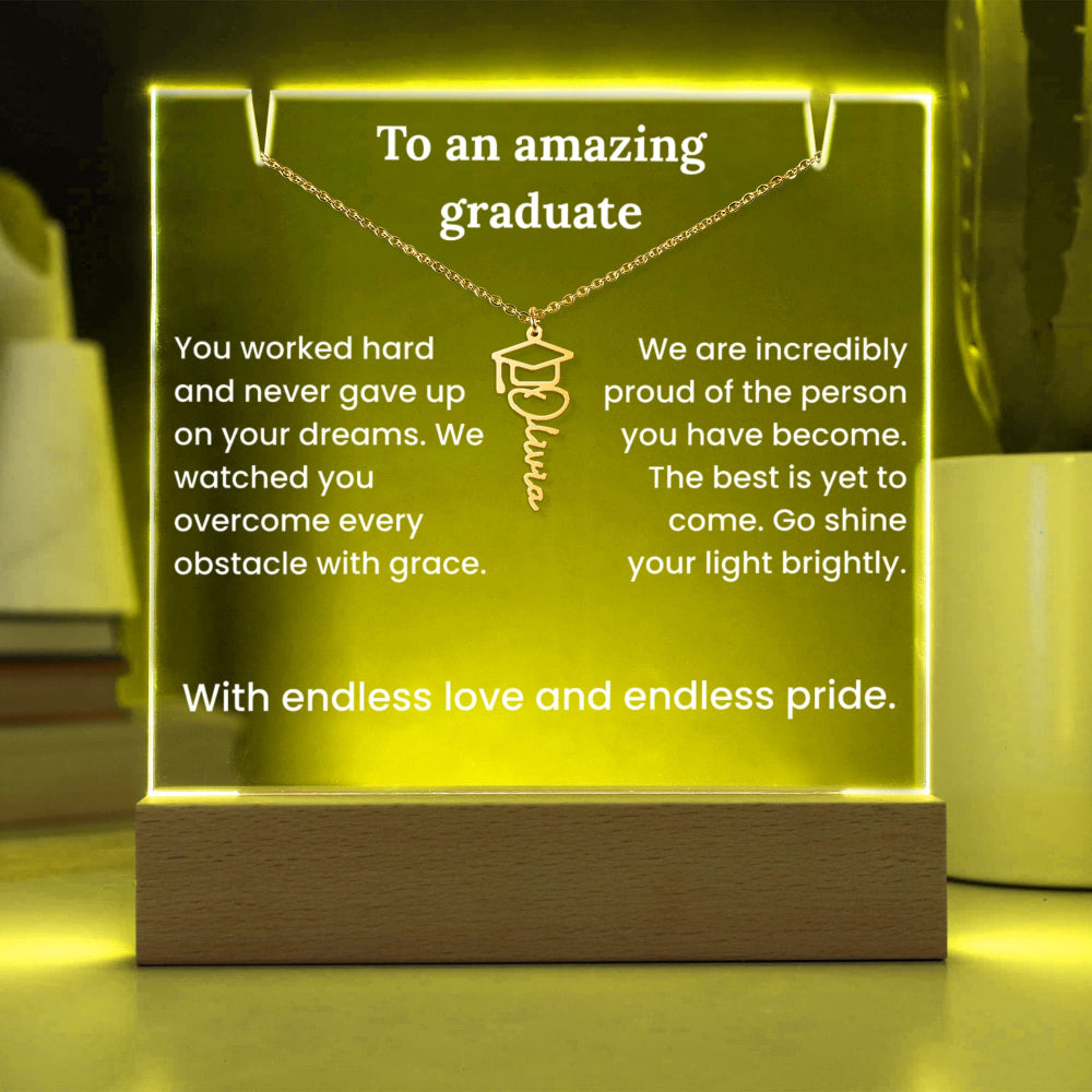 Luminous plaque with engraved message for a graduate, featuring a necklace with a graduation cap pendant.