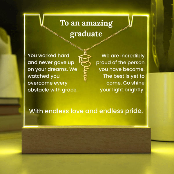 Luminous plaque with engraved message for a graduate, featuring a necklace with a graduation cap pendant.