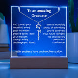 Decorative plaque with graduation message on a blue background