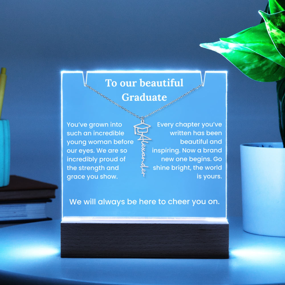 Decorative sign with a necklace design and graduation message on a blue background