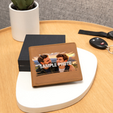 A brown leather bifold wallet with a custom photo print and 'SAMPLE PHOTO' text, displayed on a white decorative tray on a wooden table next to a black box and car keys.