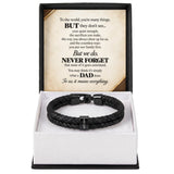 A black braided leather bracelet with a black metal clasp engraved with the name 'MIGAN', presented in an open white and black gift box with a sentimental message card for Dad.