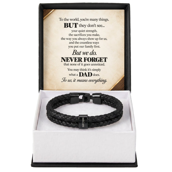 A black braided leather bracelet with a black metal clasp engraved with the name 'MIGAN', presented in an open white and black gift box with a sentimental message card for Dad.