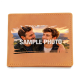 A tan leather bifold wallet shown flat against a white background, featuring a sample photo print area with a 'SAMPLE PHOTO' watermark overlay.