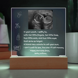 Decorative sign with ultrasound photo and text on a stand