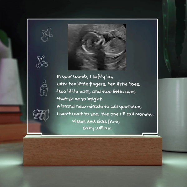 Decorative sign with ultrasound photo and text on a stand