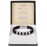A black braided leather bracelet with silver letter beads spelling out 'LOVE' and 'HATE', presented in an open gift box with a sentimental message card inside.