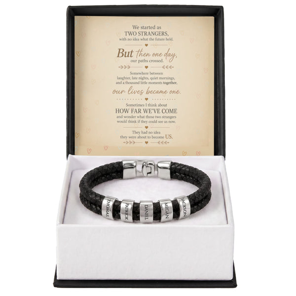 A black braided leather bracelet with silver letter beads spelling out 'LOVE' and 'HATE', presented in an open gift box with a sentimental message card inside.