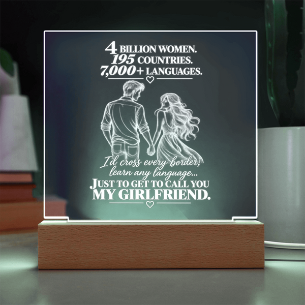 A rectangular acrylic LED night light on a wooden base, featuring a romantic quote and an illustration of a couple from behind, displayed on a tabletop.
