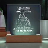 A rectangular acrylic LED night light on a wooden base, featuring a romantic quote and an illustration of a couple from behind, displayed on a tabletop.