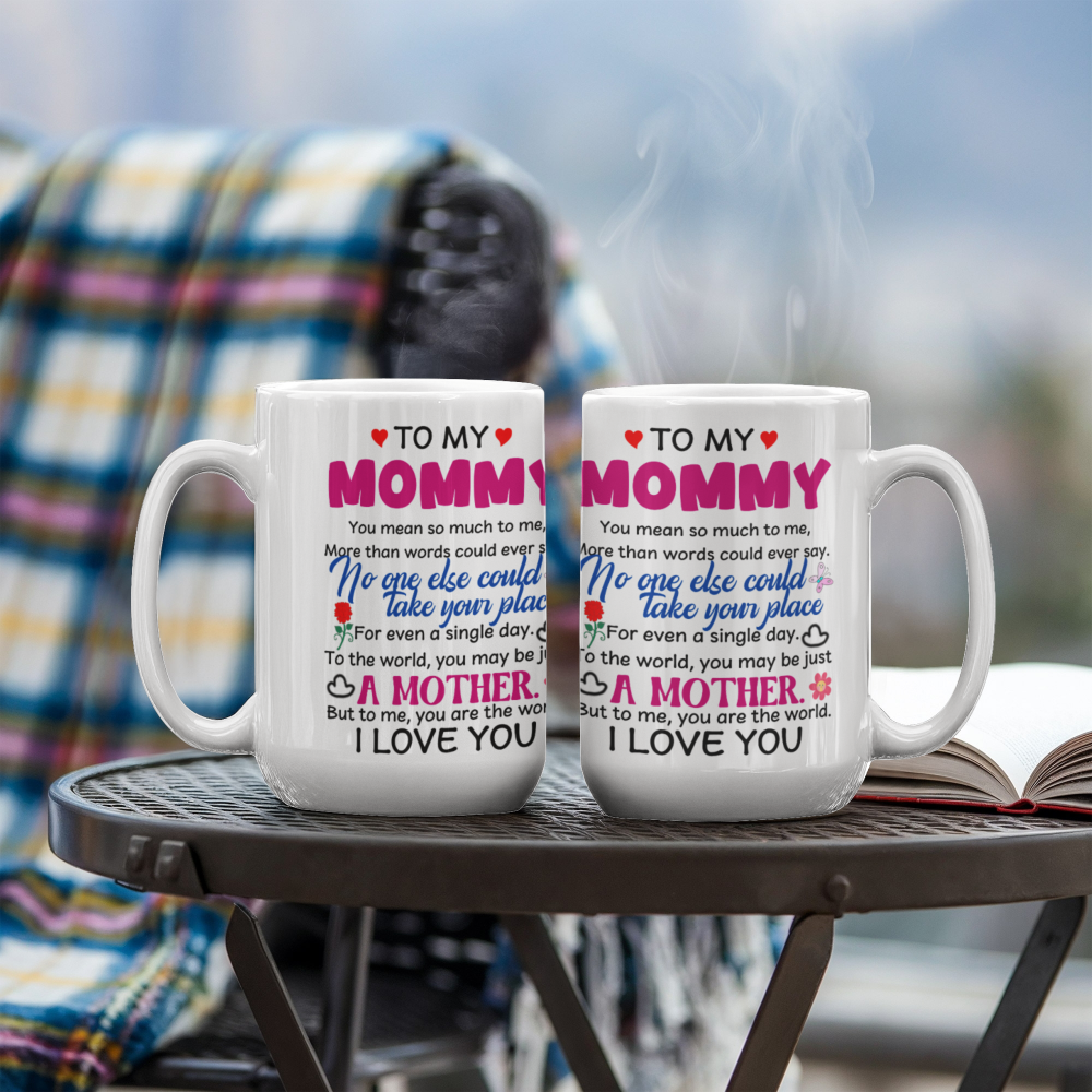 Two 15oz white mugs with personalized text on a table outdoors.