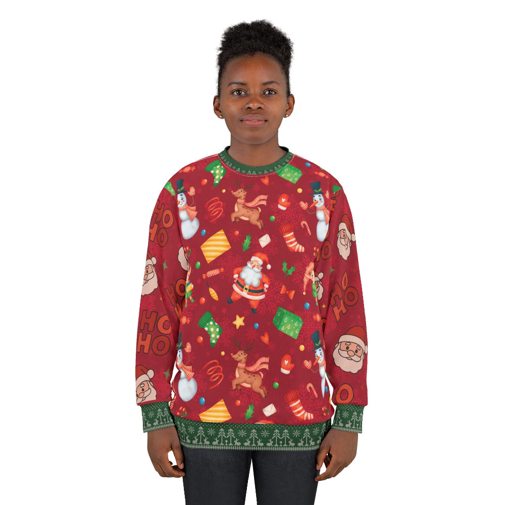 Person wearing a red Christmas sweater with festive patterns on a white background