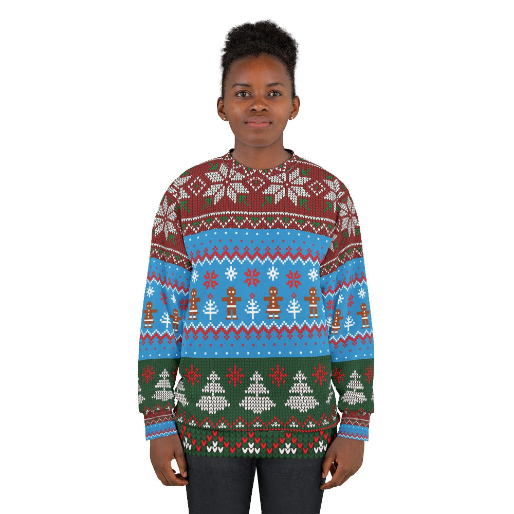 Person wearing a colorful Christmas sweater with patterns on a white background