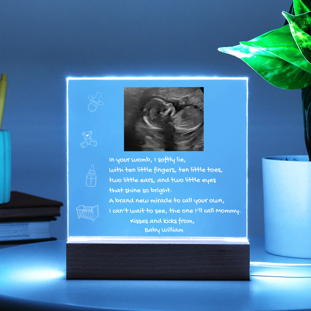  illuminated sign with ultrasound image and text on a blue background