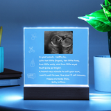  illuminated sign with ultrasound image and text on a blue background