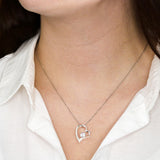 woman wearing white gold forever love necklace