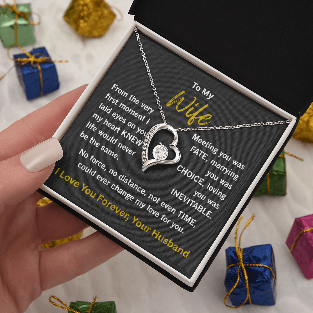 woman white gold forever love necklace holding 2 tone gift box