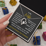 woman white gold forever love necklace holding 2 tone gift box