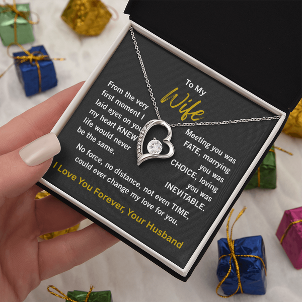 woman white gold forever love necklace holding 2 tone gift box